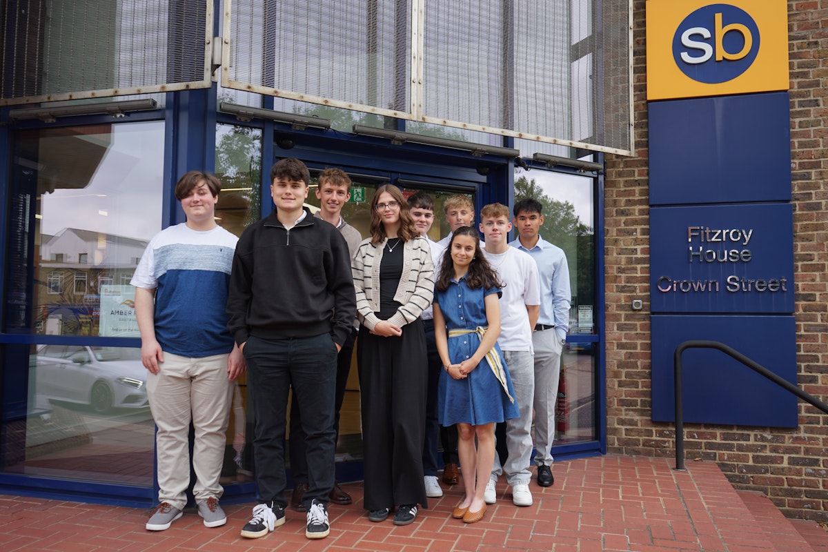New trainees standing outside the Scrutton Bland office
